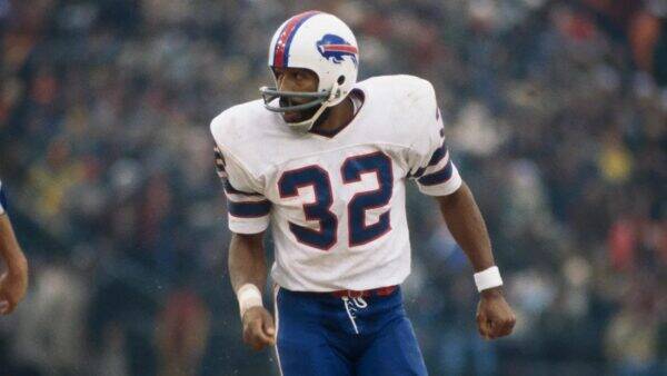 Buffalo Bills player wearing number 32 in a white away jersey, running on the field during a game.