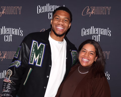 Two people posing and smiling at a photo backdrop reading 'Gentleman's Cut' and 'Cut THIRTY' festivals behind them.
