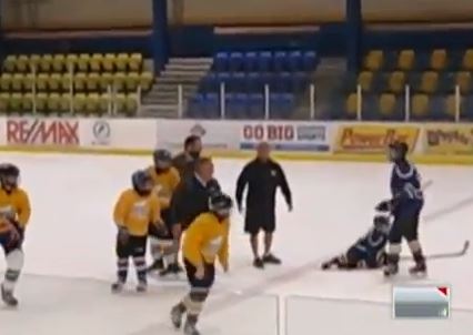 hockey coach trips kid in handshake line