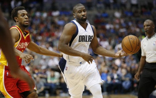Dallas Mavericks guard Raymond Felton (2) maneuvers around Houston Rockets guard Ish Smith (5) in the first half during a National Basketball Association preseason game between the Houston Rockets and the Dallas Mavericks at the American Airlines Center in Dallas Tuesday October 7, 2014. (Andy Jacobsohn/The Dallas Morning News)