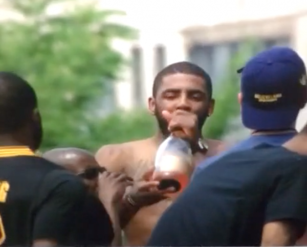 Kyrie Irving takes a shot of Henny