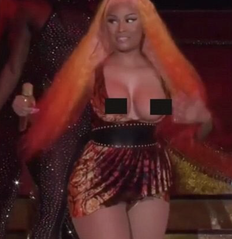 Nicki Minaj's Breasts Fall Out of Her Shirt During Concert.