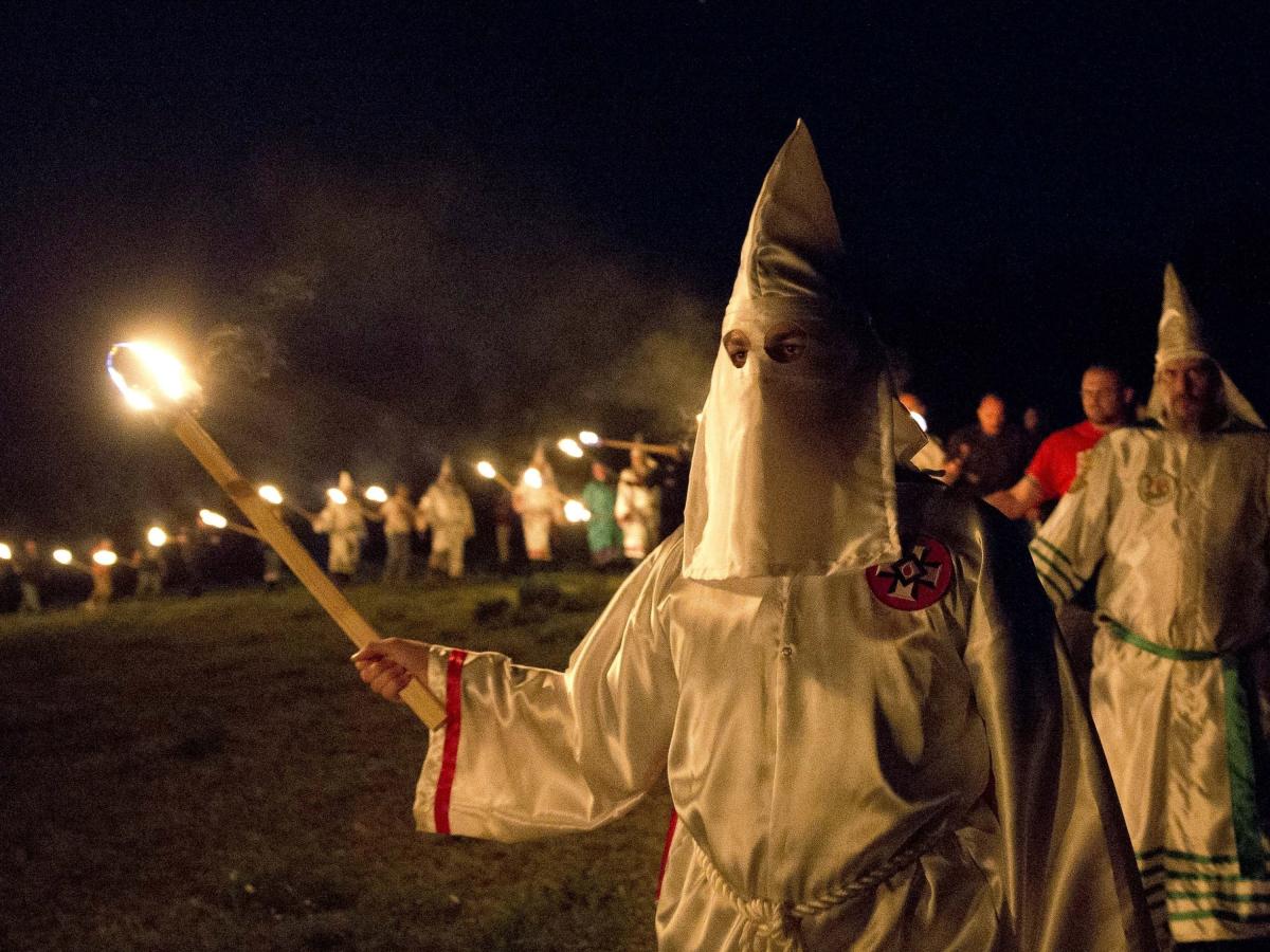 Three teenagers in Texas dressed in KKK garb for Halloween before