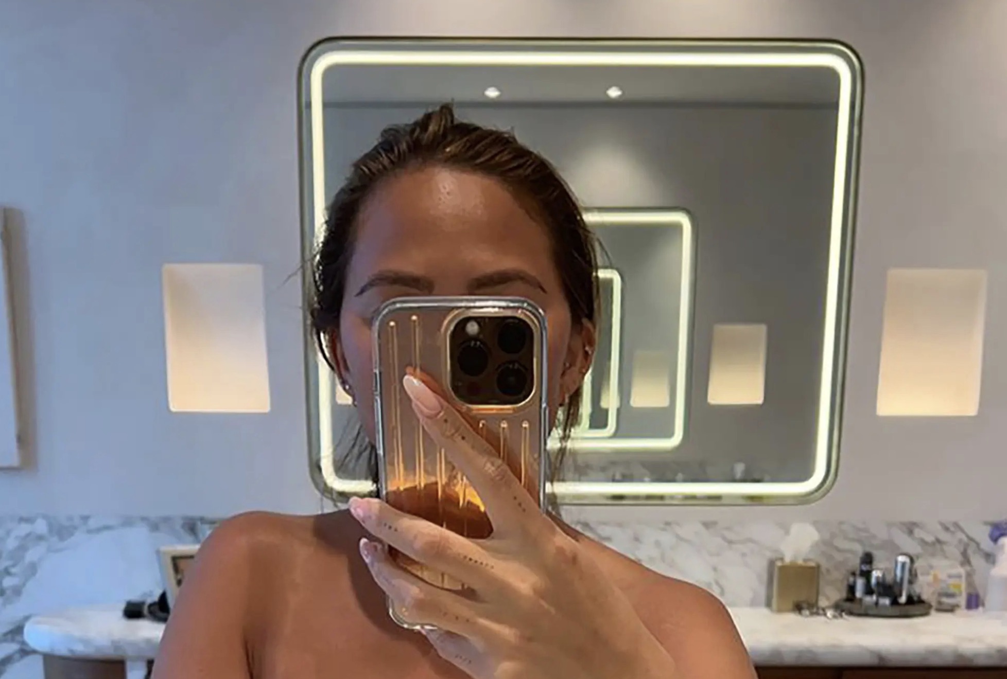 Chrissy Teigen Goes Topless To Show Off Tan Line Abs In Latest Thirst Traps For Clout 