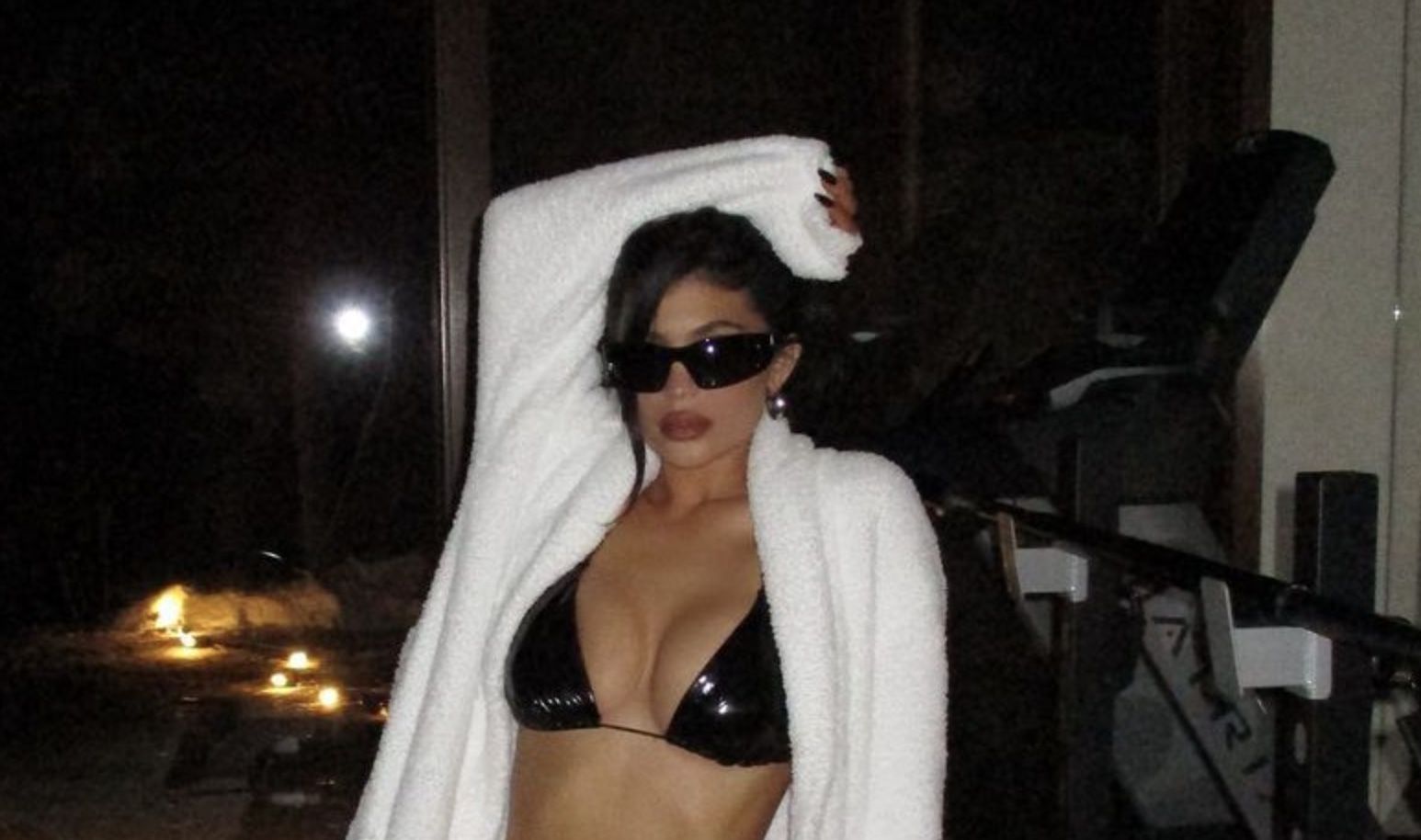 Kylie Jenner showcases her incredibly taut midriff in a black