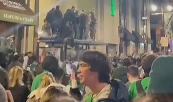 Watch Multiple Eagles Fans Get Injured After Glass Bus Stop Collapsed Under Their Weight