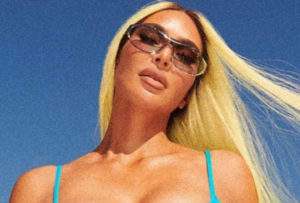 Watch Kim Kardashian Show Off Perfect Created Body in Blue Skims Bikini