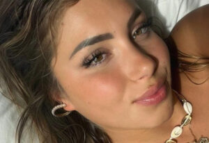 College Swimmer Andreea Dragoi Shows Off Her Boobs And Curves In A Tiny Orange Bikini
