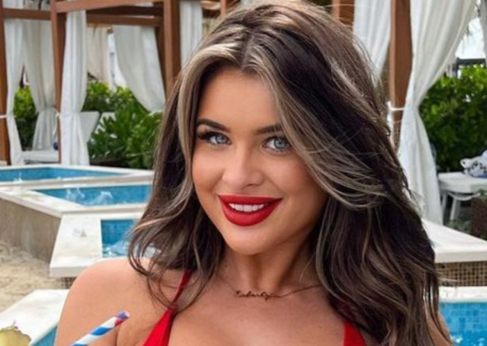 Liberty Poole Poses In Red Hot Swimsuit While Showing Off Her Massive 