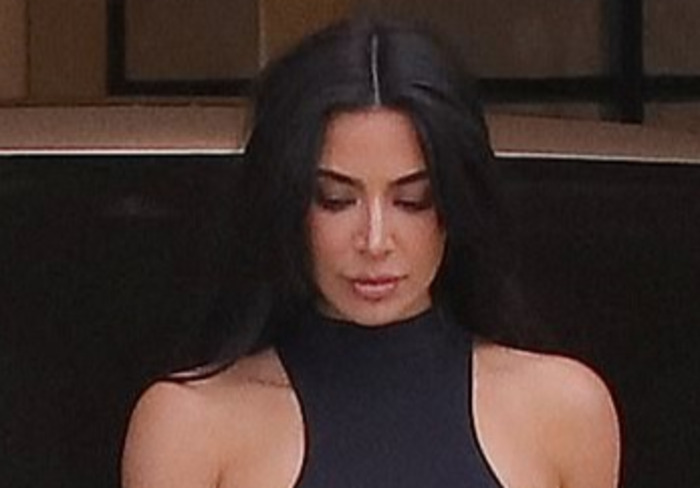 Kim Kardashian shows off her famous curves while taking a call outside her  office in Calabasas