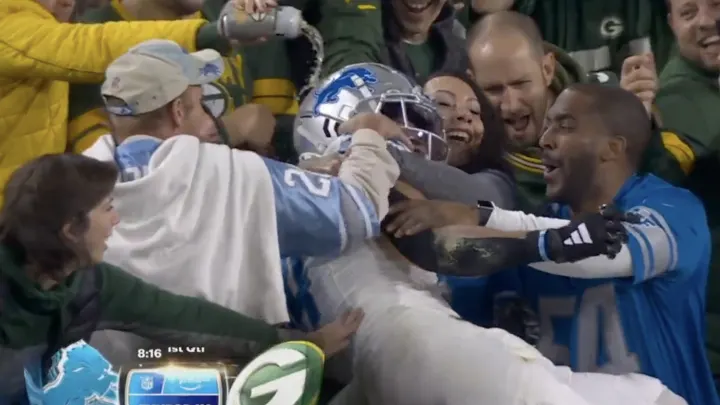 Watch Bitter Packers Fan Douse Amon-Ra St. Brown With Beer For Doing The Lambeau Leap