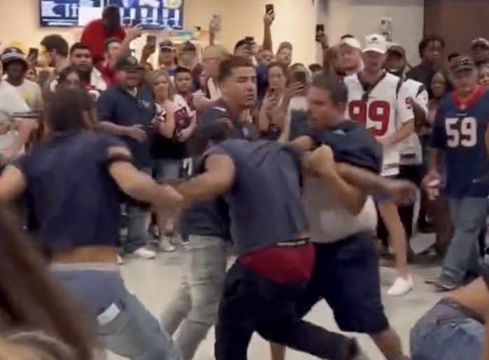 Watch Texans Fans Fight Each Other in  The Stadium While Other Fans Create a Makeshift Octagon
