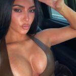 Kim Kardashian Shows Off Cleavage In Low-cut Leather Top