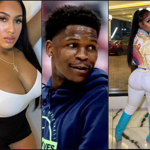 Close-up of a woman with long black hair wearing a white tank top, gold cross necklace, and neutral makeup.