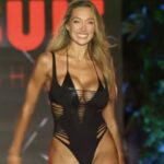 Watch Model Penny Lane Turn Heads With Massive Cleavage In Tiny Swimsuit At Miami Swim Week