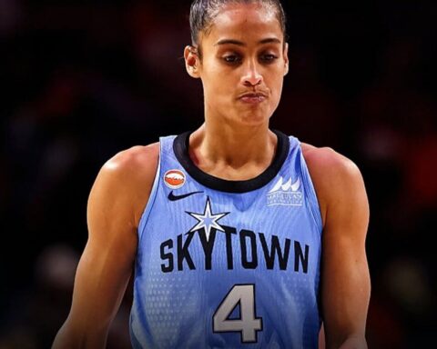 Female basketball player wearing a light blue SkyTown jersey with number 4, looking focused on the court.
