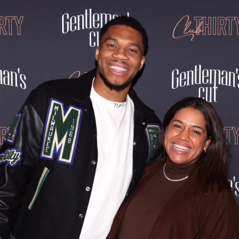 Two people posing and smiling at a photo backdrop reading 'Gentleman's Cut' and 'Cut THIRTY' festivals behind them.