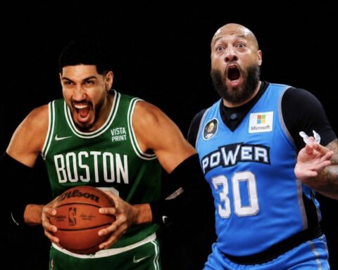 Two basketball players in green Boston and blue Power uniforms sprint during a game, one holding a basketball with a tense expression.